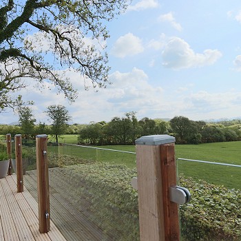 glass balcony looking out on to a field