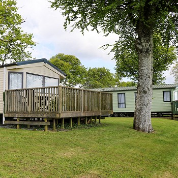 static caravans with large balcony infront of it